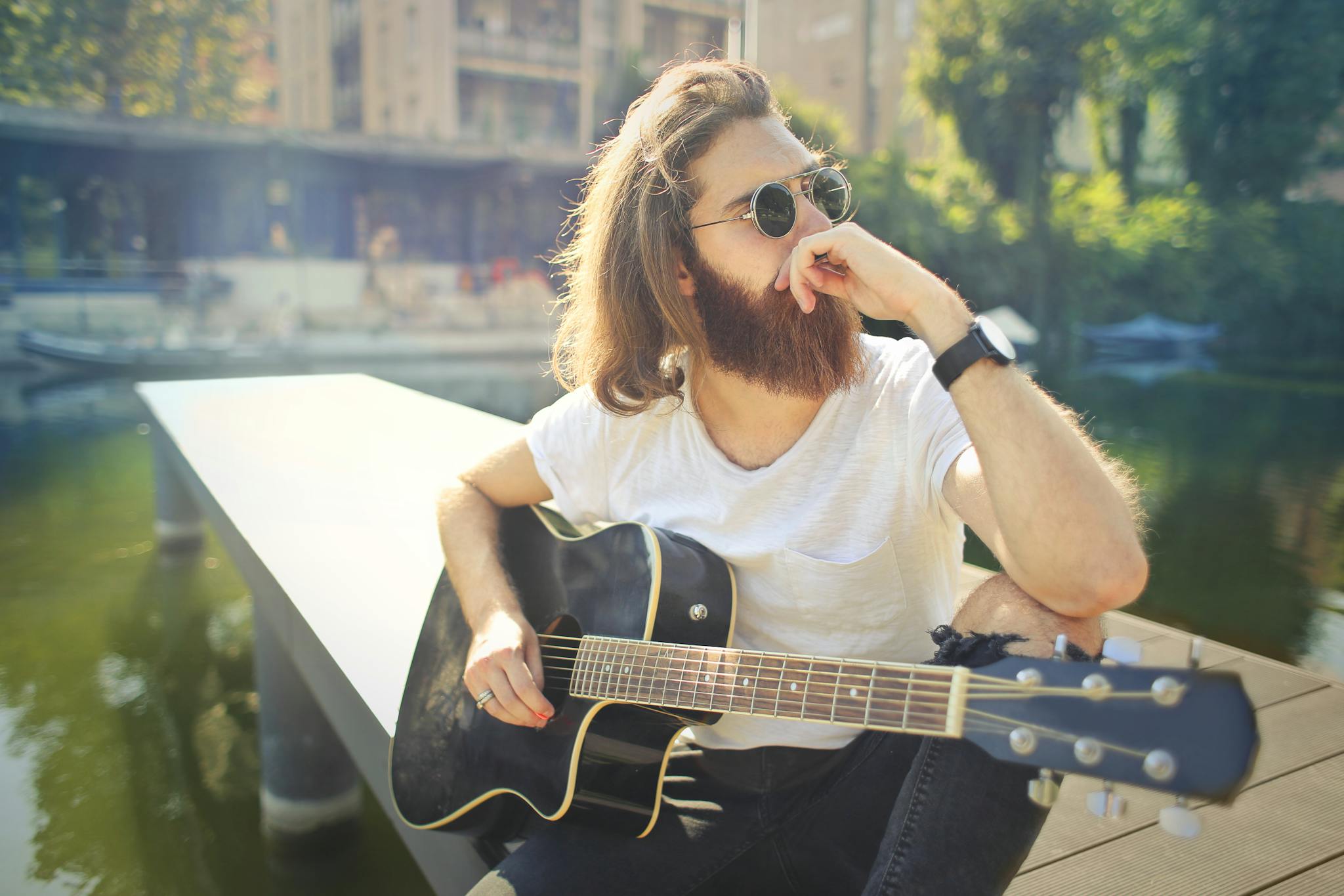 Man in White Crew Neck T-shirt Playing Acoustic Guitar